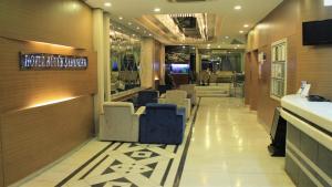 a lobby of a restaurant with chairs and a bar at Hotel Buyuk Sahinler in Istanbul +27 photos