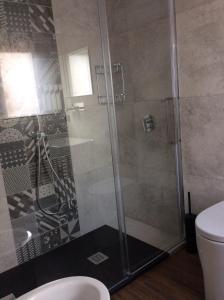 a shower with a glass door in a bathroom at Al Borgo in Gela