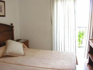 Giường trong phòng chung tại Hostal Soledao