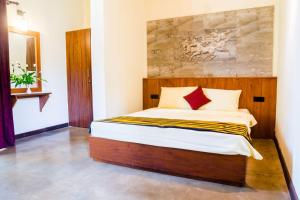 Letto o letti in una camera di Roshara Nalla
