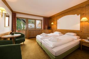 Letto o letti in una camera di Hotel Zum Pinzger