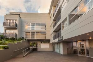 an external view of a building with a walkway at Quest Ponsonby Serviced Apartments in Auckland