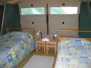 Tempat tidur dalam kamar di Great Keppel Island Holiday Village