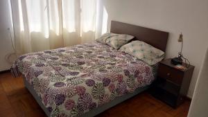 Cama ou camas em um quarto em Apartamento Valparaiso