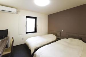 Postel nebo postele na pokoji v ubytování The Kato Hotel + 25 fotografií