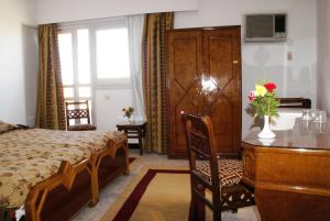 Postel nebo postele na pokoji v ubytování Sara Hotel Aswan