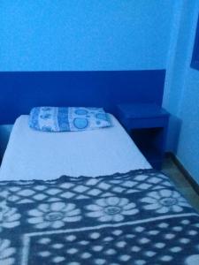 Postel nebo postele na pokoji v ubytování Oasis hotel