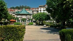 a park with a gazebo in front of a building at Virginia Redondela in Redondela