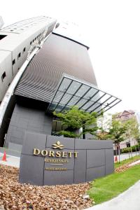 a building with a sign in front of it at Dorsett Bukit Bintang Residence by De Space in Kuala Lumpur