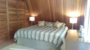 A bed or beds in a room at Gabriola Central B&B