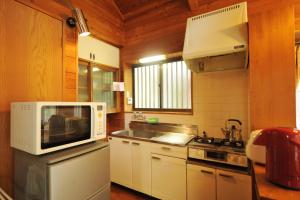 Kuchyň nebo kuchyňský kout v ubytování Izumigo AMBIENT Yatsugatake Cottage
