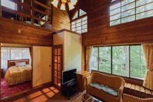 Postel nebo postele na pokoji v ubytování Izumigo AMBIENT Yatsugatake Cottage + 32 fotografií