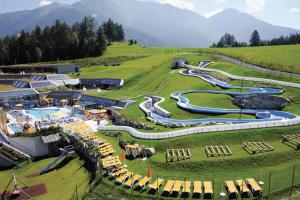 a resort with several water slides in a field at Haus Kneissl in Seefeld in Tirol