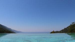 a lake with a blue sky and blue water at Ölüdeniz Loft - Adults Only in Oludeniz