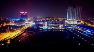 a view of a city at night with lights at De Houz @ Setia Alam Trefoil Homestay in Shah Alam