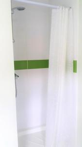 a bathroom with a shower with a white curtain at Swindon Old Town Duplex - EnterCloud9SA in Swindon
