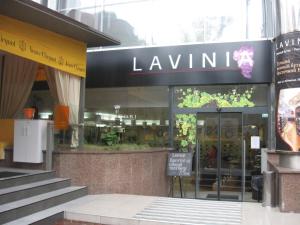 a store front of a law firm with a sign in front at Diplomat ApartHotel in Kyiv