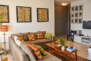 Een zitgedeelte bij Appartement moderne moroccan/African décoration