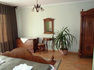 Postel nebo postele na pokoji v ubytování Pension Magnolia