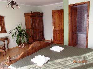 Postel nebo postele na pokoji v ubytování Pension Magnolia