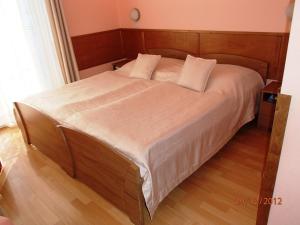 Postel nebo postele na pokoji v ubytování Pension Magnolia