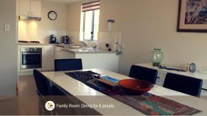 a kitchen with a table with a bowl on it at SERENITY of MANDURAH in Mandurah