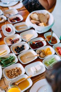a table topped with plates of food and bowls of food at Lycia Hotel in Kaş