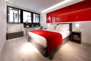 
מיטה או מיטות בחדר ב-Eurostars Central
