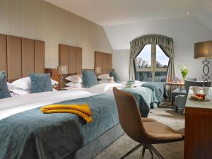 Voodi või voodid majutusasutuse Castleknock Hotel toas
