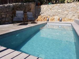 Der Swimmingpool an oder in der Nähe von Villa townhouse Calvario