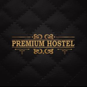 a luxury hotel sign with a black and gold logo at PREMIUM Hostel in Berlin