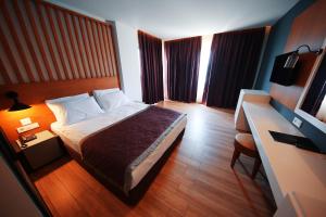 Кровать или кровати в номере Sey Beach Hotel & Spa