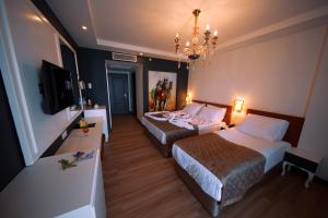 Кровать или кровати в номере Sey Beach Hotel & Spa