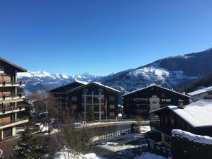 a view from the balcony of a resort in the mountains at Greppon Blanc A2 in Nendaz