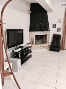 A television and/or entertainment centre at Savva's Surf House
