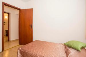Posteľ alebo postele v izbe v ubytovaní Apartment Puh