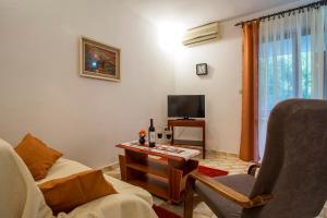 Televízia a/alebo spoločenská miestnosť v ubytovaní Apartment Puh