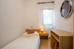 Posteľ alebo postele v izbe v ubytovaní Apartment Puh