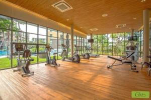 a gym with treadmills and exercise equipment in a building at rain condo Cha-am 2 bedroom by Napa in Cha Am
