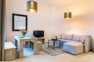 a living room with a couch and a table at Loft in the middle of Berlin in Berlin