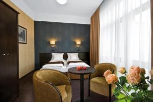 Posteľ alebo postele v izbe v ubytovaní Hotel Senator
