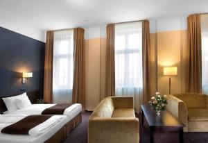 Posteľ alebo postele v izbe v ubytovaní Hotel Senator