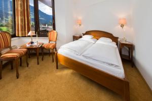 Letto o letti in una camera di Hotel Zum Pinzger