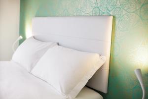 Postel nebo postele na pokoji v ubytování Hotel Albatros