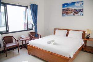 En eller flere senge i et værelse på Thao Hieu Homestay Hoi An