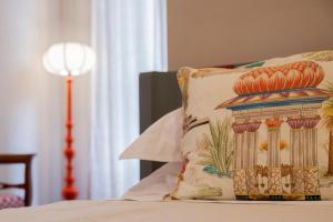 Posteľ alebo postele v izbe v ubytovaní Casa Fabbrini Fancy Suites