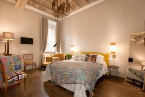 Posteľ alebo postele v izbe v ubytovaní Casa Fabbrini Fancy Suites