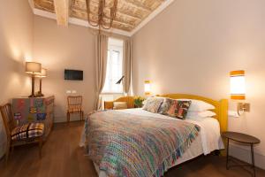 Posteľ alebo postele v izbe v ubytovaní Casa Fabbrini Fancy Suites