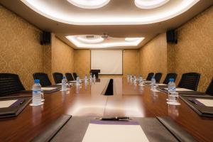 a conference room with bottles of water on a table at Savoy Le Grand Hotel Marrakech in Marrakech
