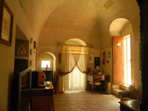 a living room with a door with a curtain at La Casa del Tartufaio in Matera